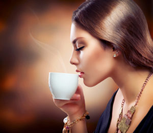 Beautiful Girl Drinking Tea or Coffee